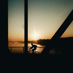 Silhouette of bridge at sunset