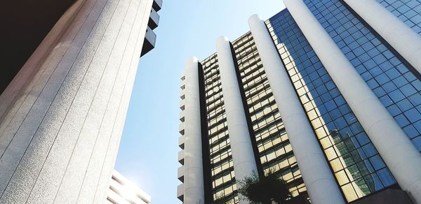 Low angle view of modern buildings against sky