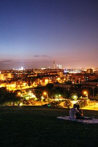 High angle view of illuminated town against sky