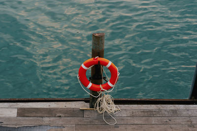 High angle view of rope tied on wooden post