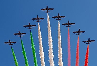 Low angle view of airplane flying against sky