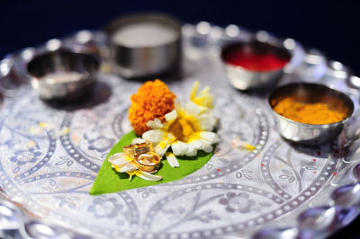 Close-up of flowers in plate on table