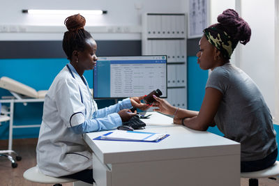 Side view of doctor working at clinic