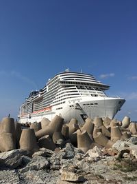 Panoramic view of beach by buildings against sky