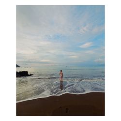 Man looking at sea against sky