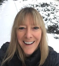 Portrait of smiling woman in snow