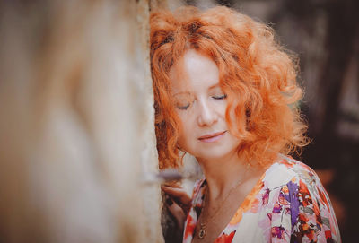 Portrait of woman looking away outdoors