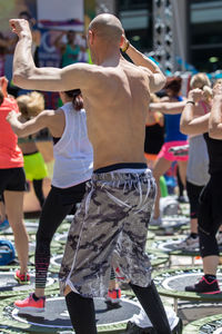 Rear view of people walking outdoors