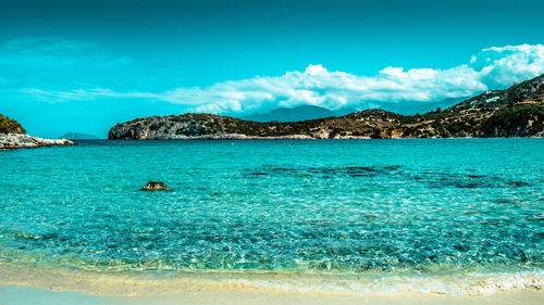 Scenic view of sea against blue sky