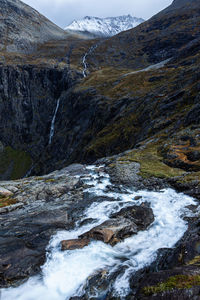 Scenic view of stream flowing through rocks