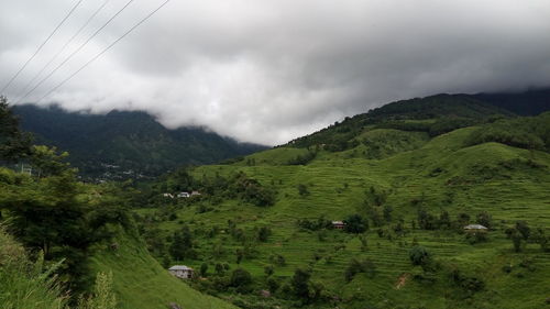 Scenic view of landscape against cloudy sky