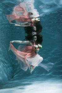 Woman swimming in pool