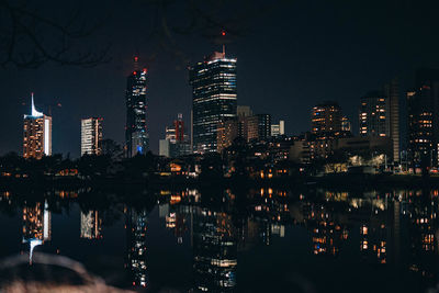 Illuminated buildings in city at night