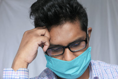 Close-up portrait of boy wearing eyeglasses