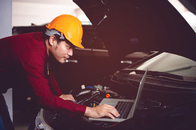 The car mechanic is checking the availability of a good, safe driving companion. 