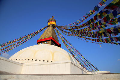 Low angle view of building against clear blue sky