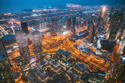 High angle view of illuminated buildings in city at night