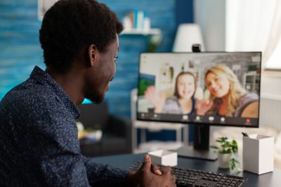 Man on video call with friends