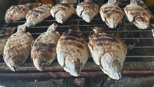 High angle view of meat on barbecue grill