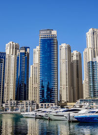 Modern buildings in city against clear sky