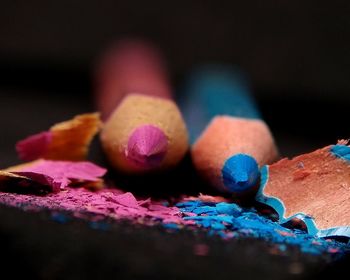 Extreme close-up of colored pencils on table