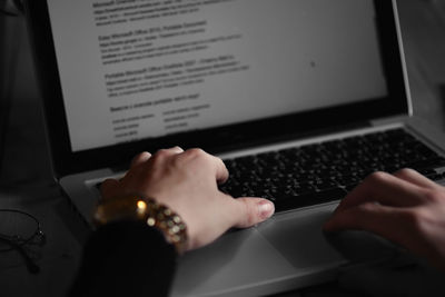 Low section of person using mobile phone