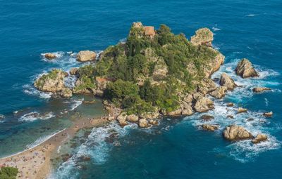 High angle view of rocks at sea shore