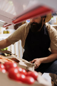 Midsection of man preparing food