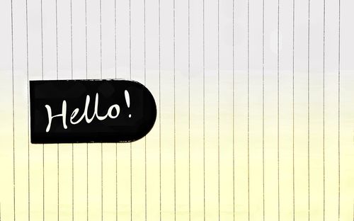 High angle view of hello text on paper