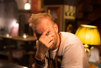 Close-up of man with illuminated lighting equipment