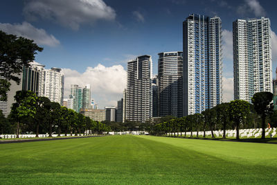 Skyscrapers in city against sky