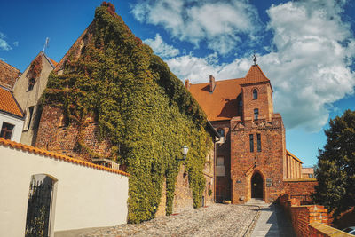 Panoramic view of temple amidst buildings against sky