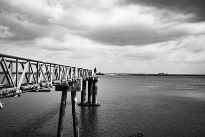 Bridge over sea against sky