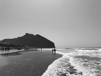 Scenic view of beach against clear sky