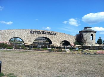 Built structure against blue sky and clouds