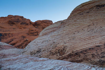 Scenic closeup view of striped rocky mountains in red rock national park against a clear sky