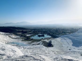 High angle view of snow covered mountain against sky