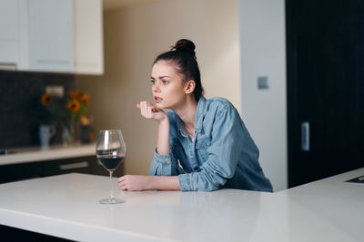 Young businesswoman working at table