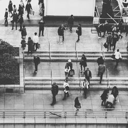 High angle view of people walking on stairs