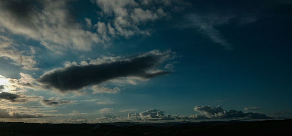 View of clouds over landscape