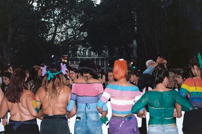 Group of people standing in front of trees