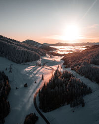 Scenic view of snowcapped mountains against sky during sunset