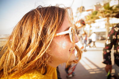 Close-up of smiling woman wearing sunglasses