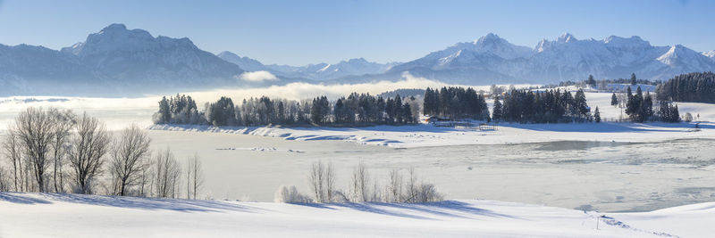 Scenic view of snow covered mountains against sky