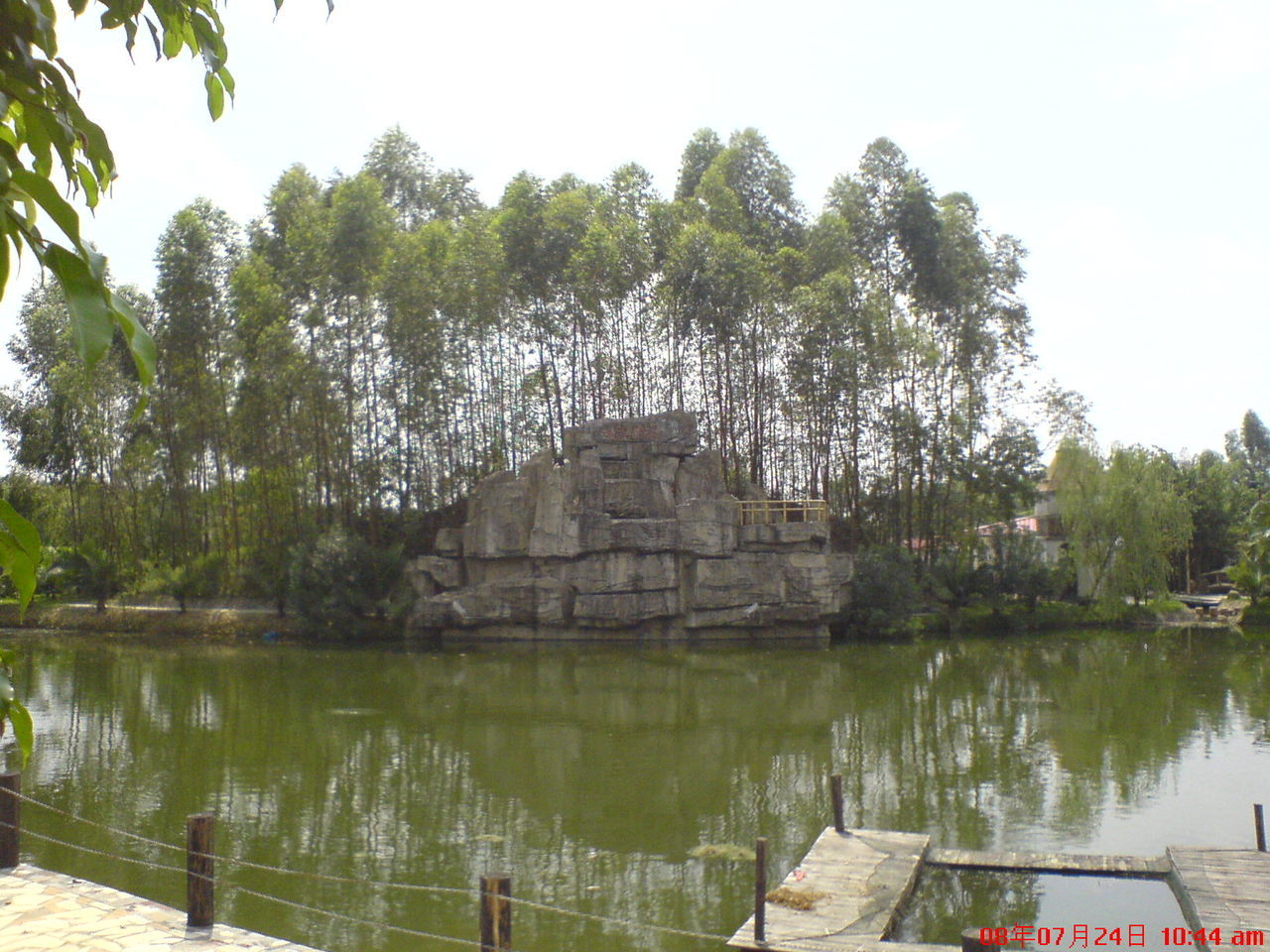 tree, water, architecture, built structure, plant, lake, reflection, nature, sky, building exterior, day, history, the past, waterfront, travel destinations, no people, outdoors, travel, building