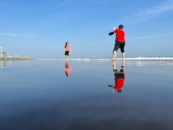 People walking on beach