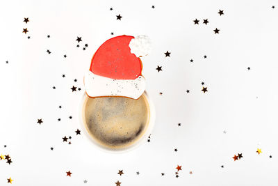 High angle view of coffee on table against white background