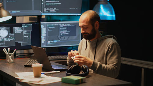 Midsection of man working in office