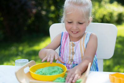 Portrait of cute girl holding ice cream