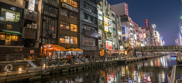 Reflection of illuminated buildings in canal at night